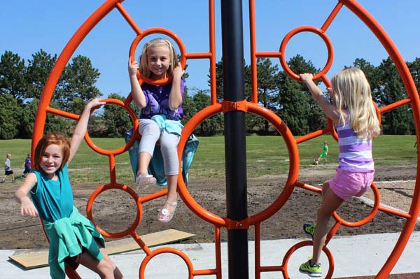 Children climbing on a playground structure